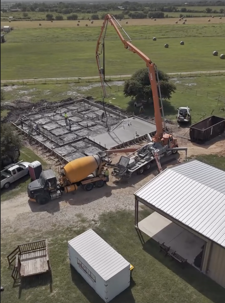 Concrete pump placing a rural foundation